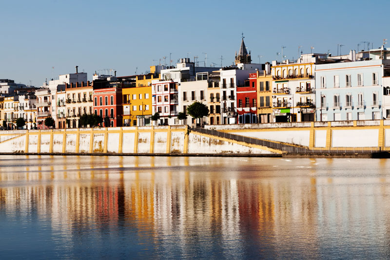 City trip Seville: view of the colourful Triana district, city break Sevilla, Spain