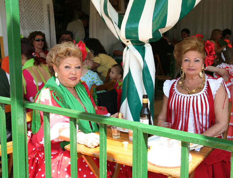 Women in flamenco dresses in Seville, City break Sevilla, Spain