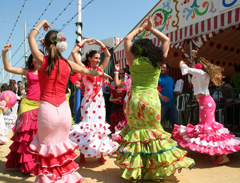 Women dance during the Feria de Abril, Seville, Spain