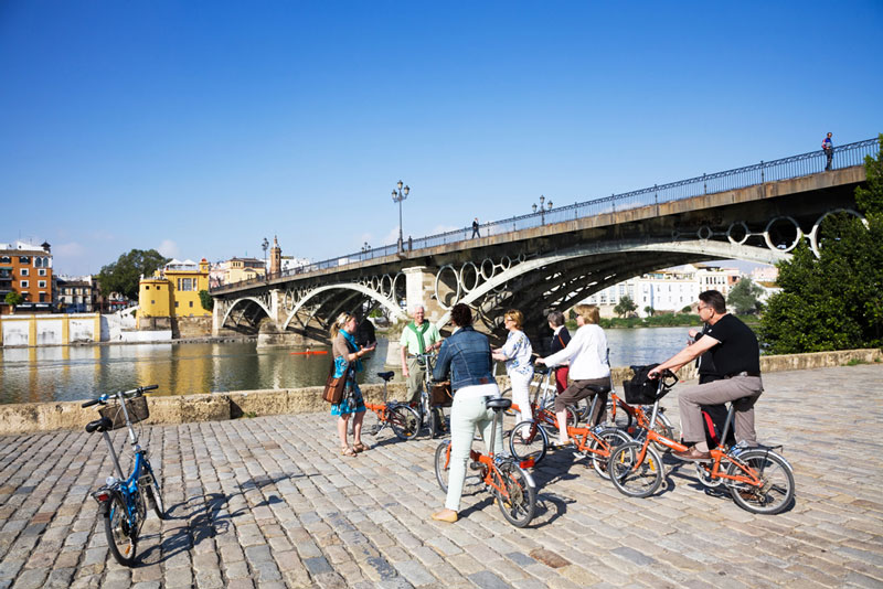 Explore the city by bike with a local, city trip Seville, Spain