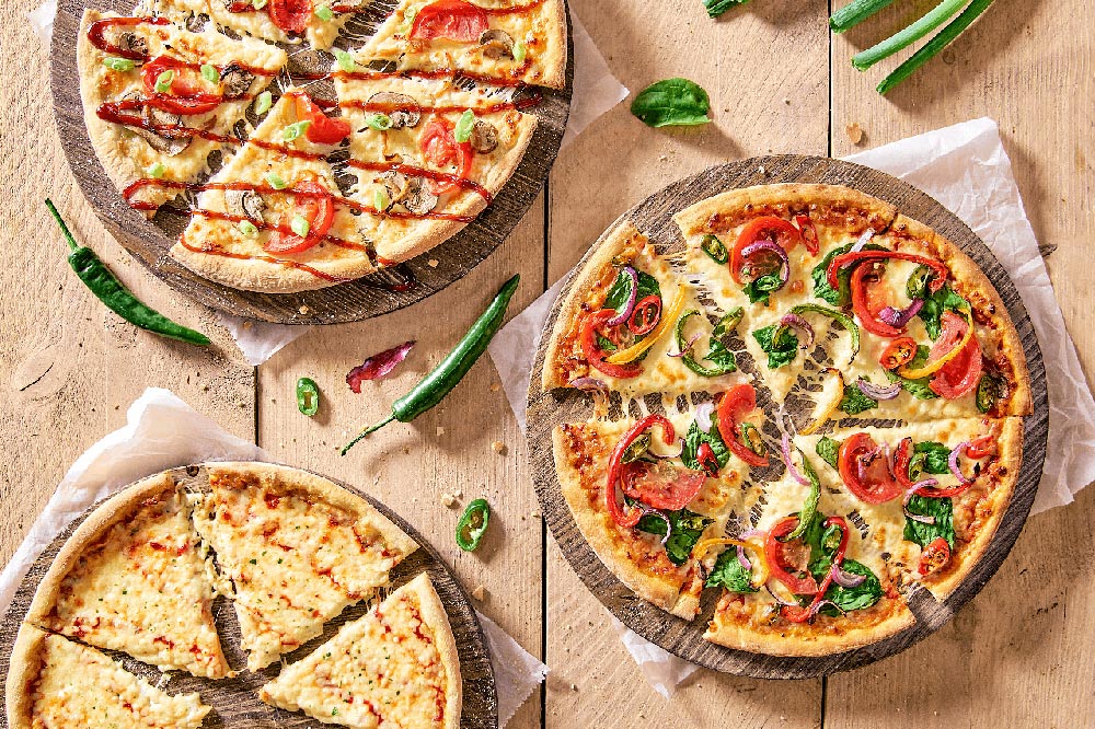 Je kunt uit drie vegan pizza's kiezen.